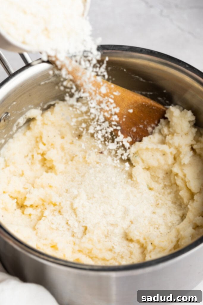 Dehydrated potatoes being poured into a pot of mashed potatoes, demonstrating an effective thickening method
