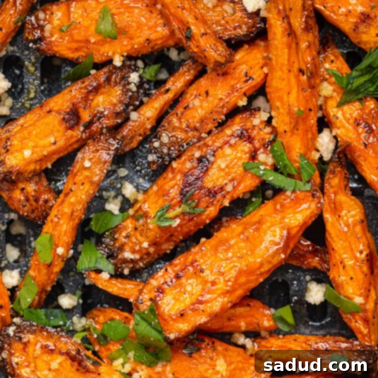 Air fryer carrots in an air fryer basket, ready to be served.