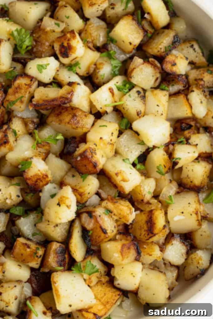 Dixie Skillet Spuds 3 Closeup view of southern fried potatoes in a large bowl