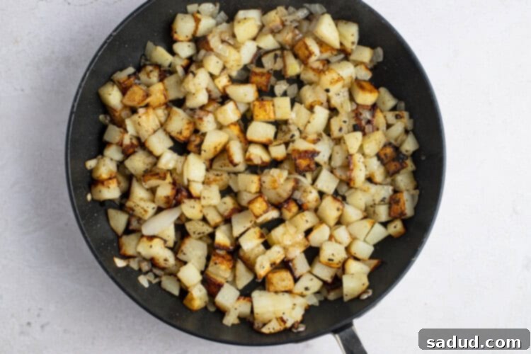 Dixie Skillet Spuds 7 Pan-fried potatoes and onions in large cast iron skillet
