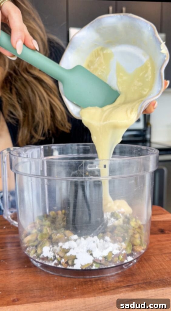 Pistachios being boiled in a pot, a key step for softening