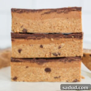 Close-up of a stack of healthy caramel cookie dough protein bars with chocolate topping.