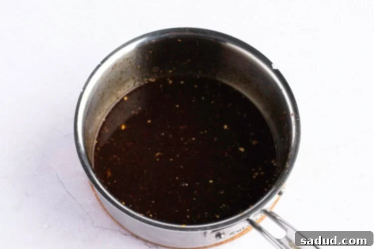 Orange sauce in small saucepan