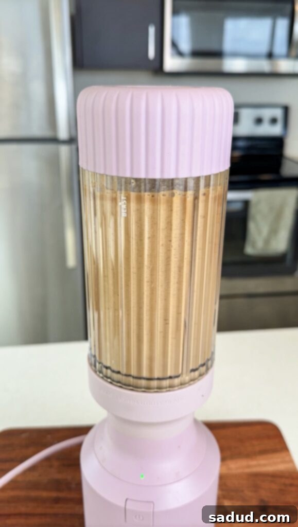 banana iced coffee in a glass with foam