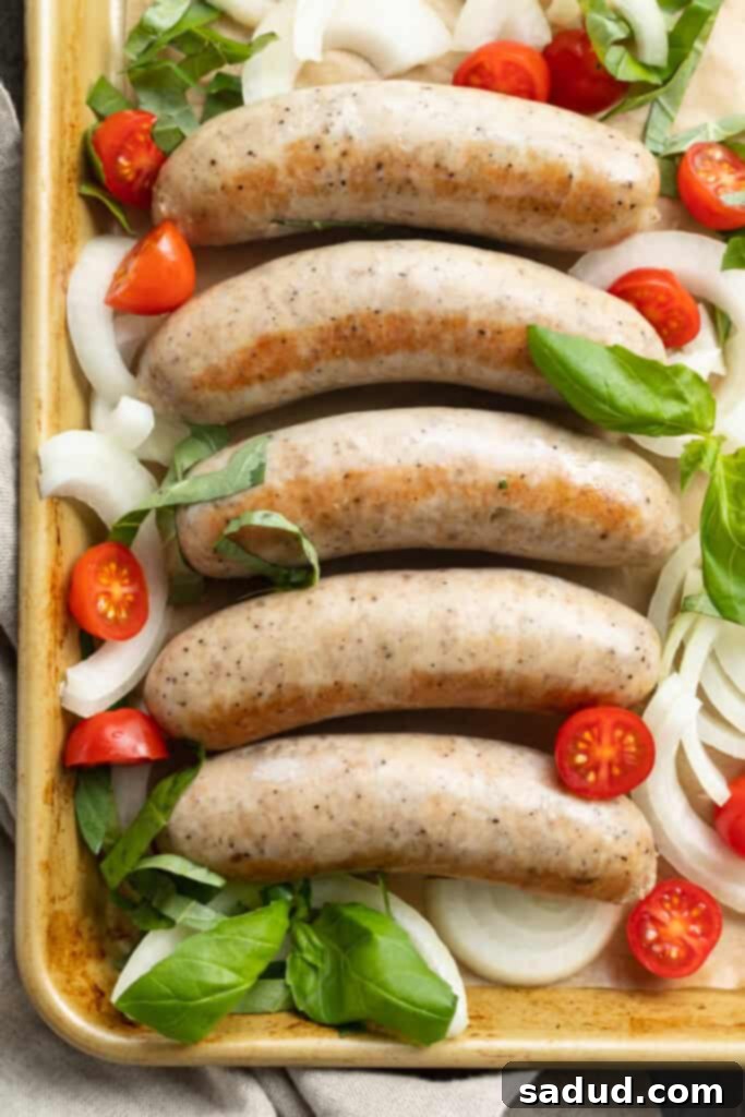 Overhead image of freshly cooked instant pot Italian sausage on a baking sheet, ready to be served.