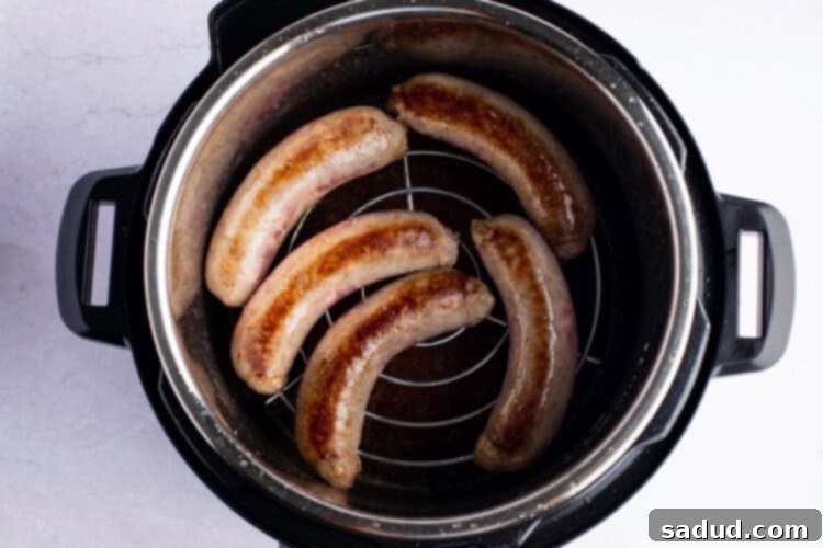 Overhead photo of bratwurst on trivet in Instant Pot.