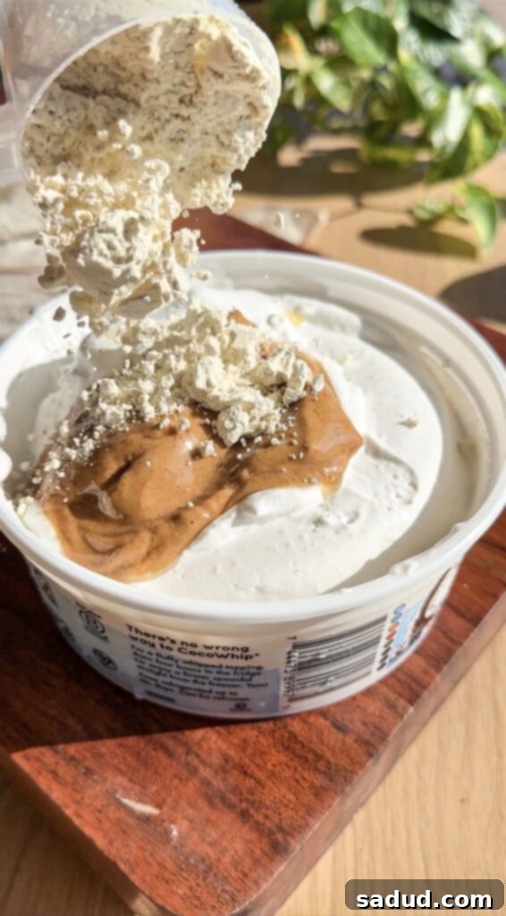 Mixing graham cracker dough in a bowl.