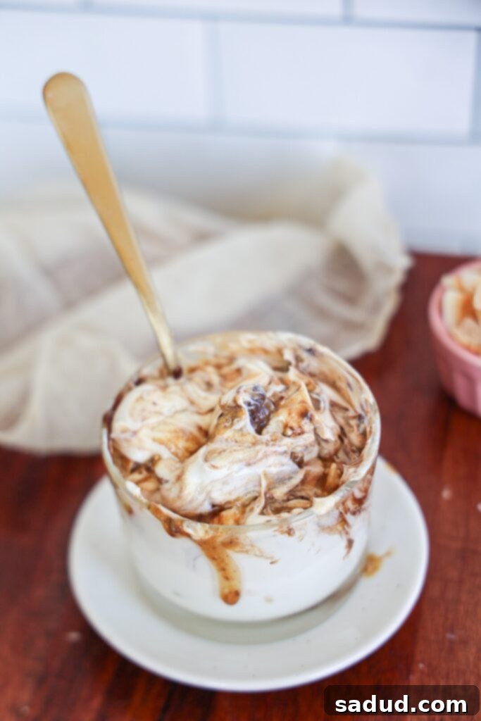 Decadent Almond Joy Yogurt Bowl 2 A high-protein Greek yogurt bowl with chocolate, toasted coconut, and almond butter, showcasing its delicious layers and healthy appeal.