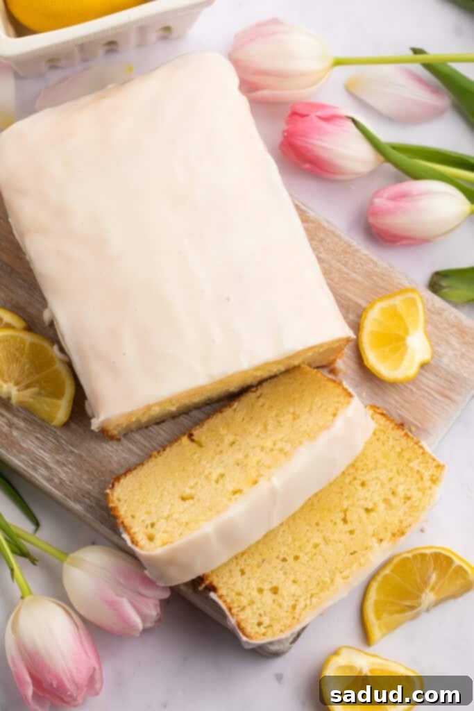 Irresistible Gluten-Free Lemon Cake 2 Overhead view of a perfectly baked gluten-free lemon pound cake, with two glistening slices presented next to the main loaf.