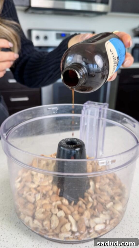 Cookie dough flavored cashew butter in a glass jar, ready to serve