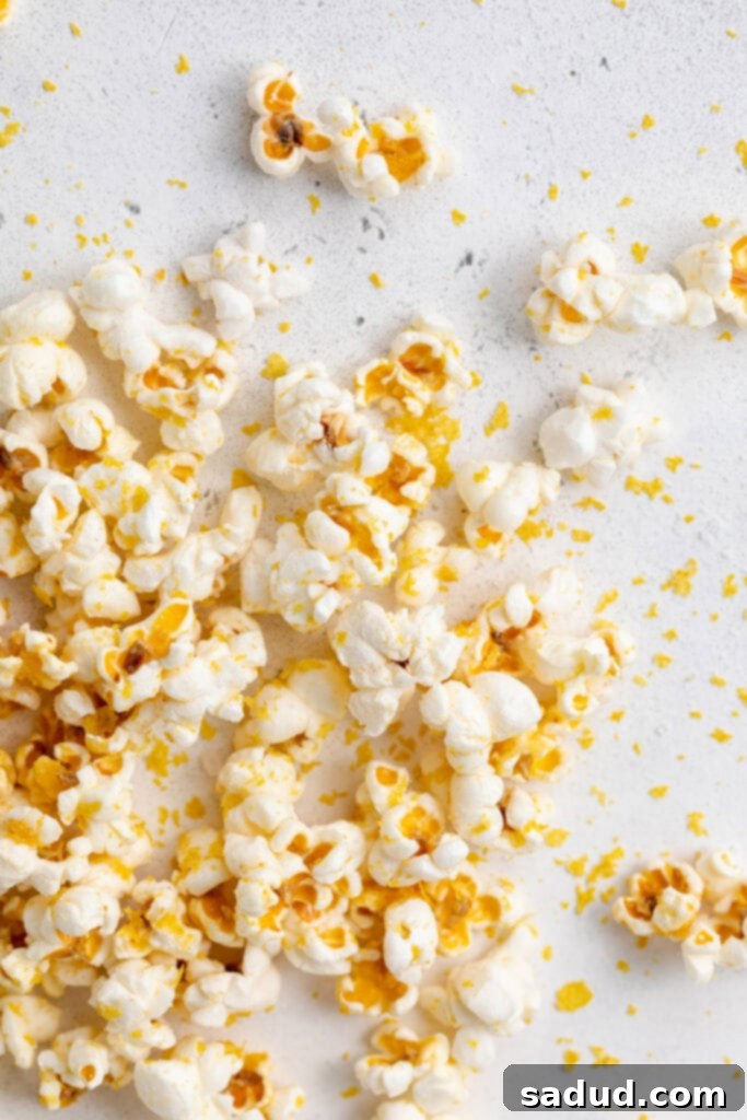 Popcorn scattered on a white background.