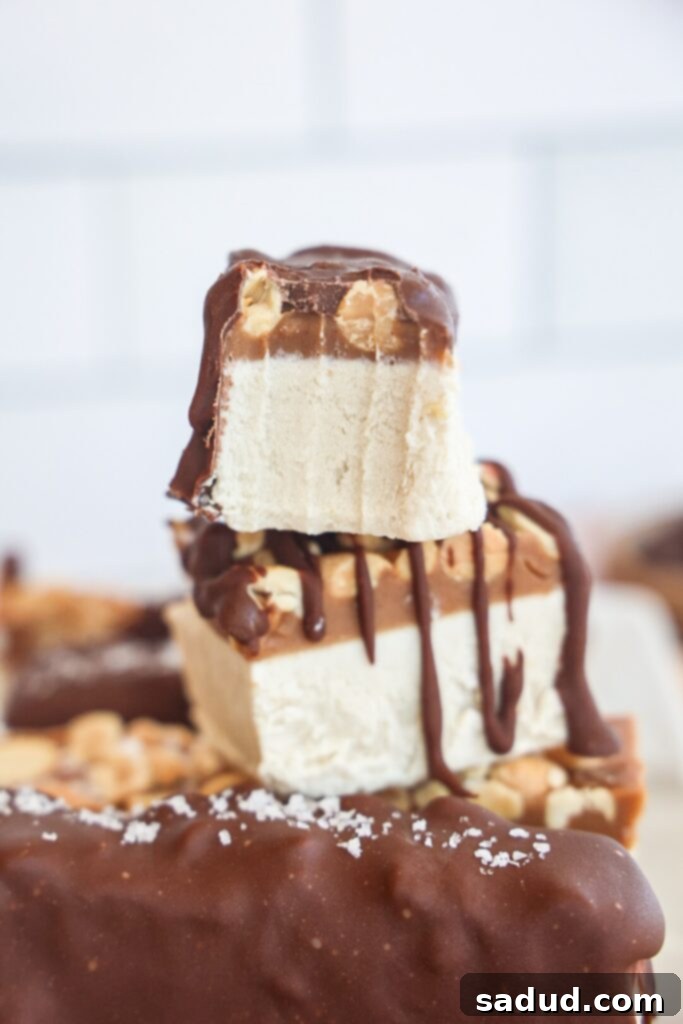 Healthy, vegan snickers ice cream bars with chocolate coating.
