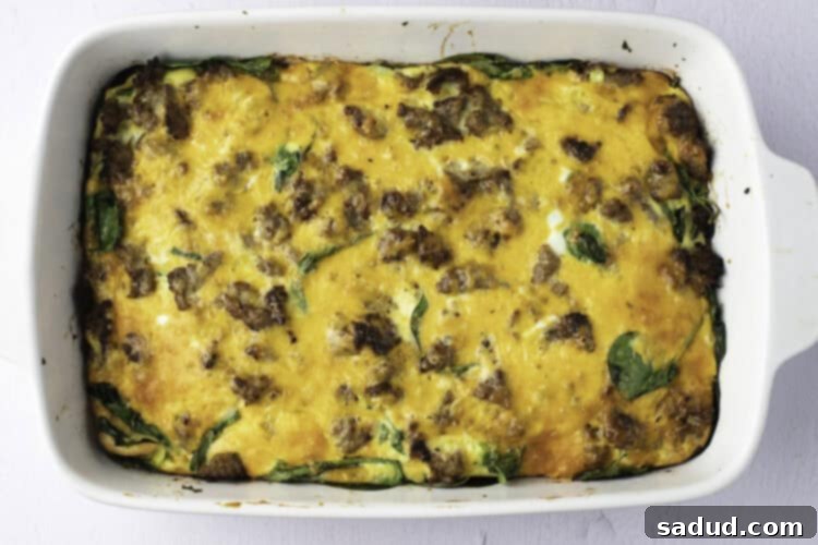 Overhead view of a fully-baked keto breakfast casserole in a white casserole dish.