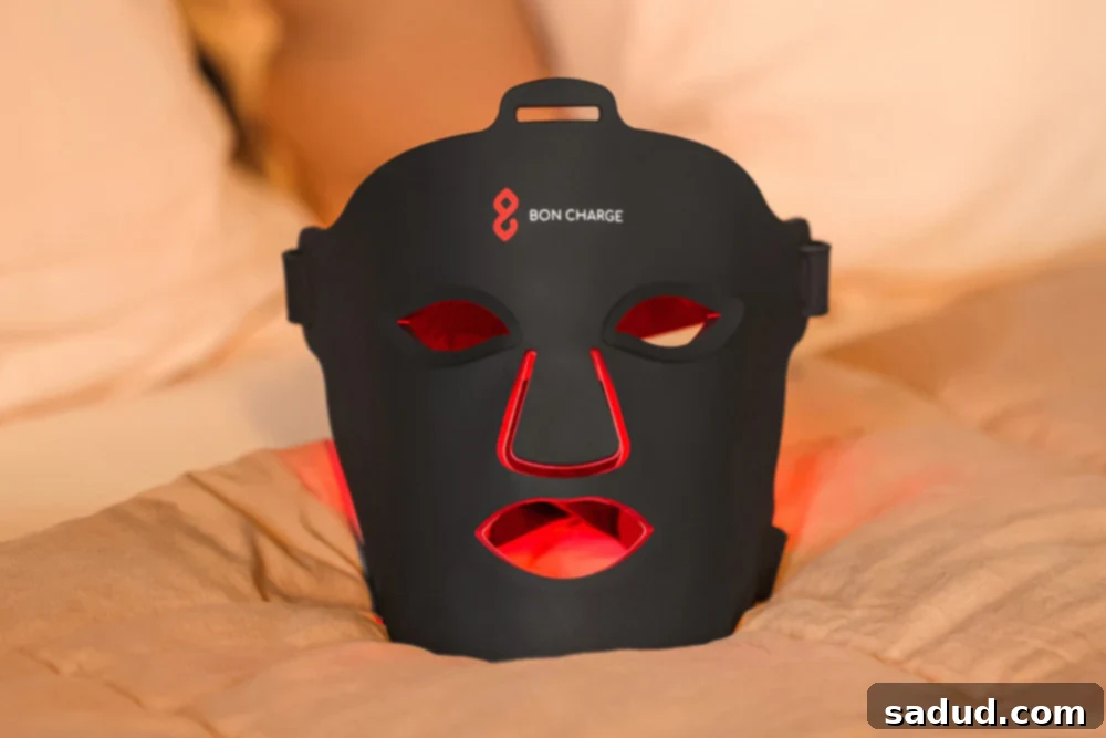Person wearing a red light face mask for skin rejuvenation.