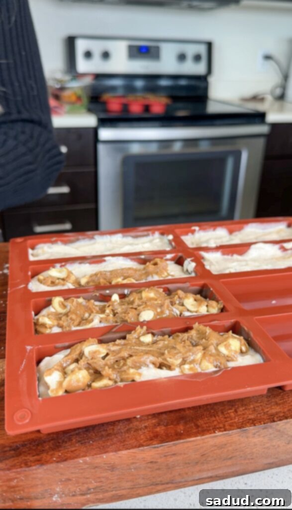 Process shot 3: Adding the caramel and nut layer to the frozen bars