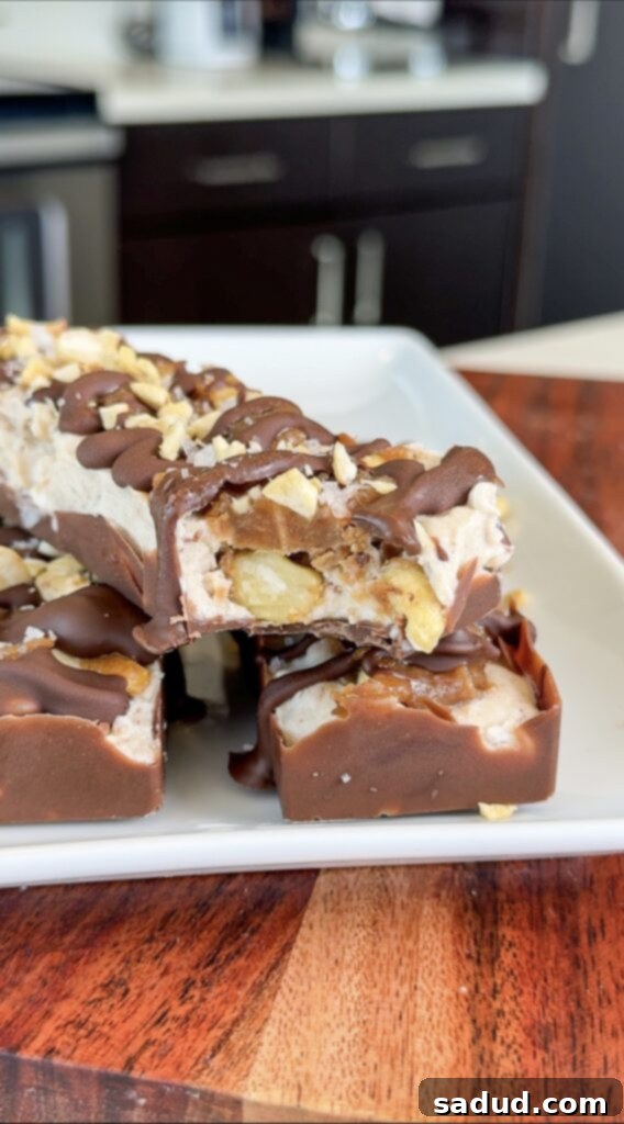 Close-up of a finished Copycat KIND Frozen Treat Bar, showing layers and crunchy nuts