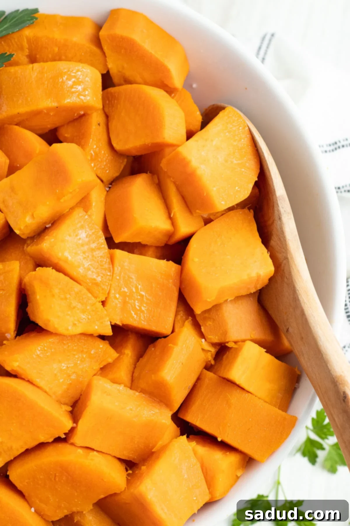 The Best Way to Boil Sweet Potatoes 2 Overhead view of a large white bowl of cubed sweet potatoes, showing how to boil sweet potatoes for the holidays.
