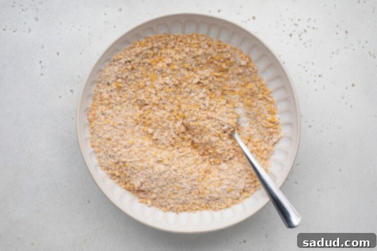 Breading mixture for hot honey chicken in a shallow bowl.