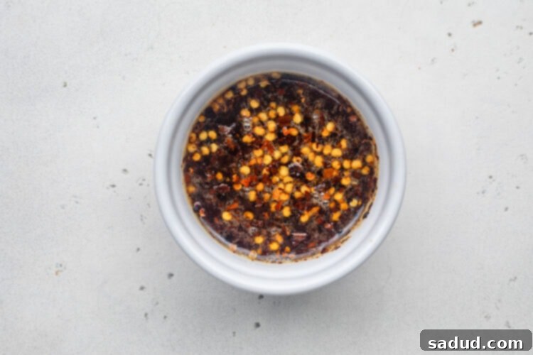 Hot honey sauce in a small ramekin.