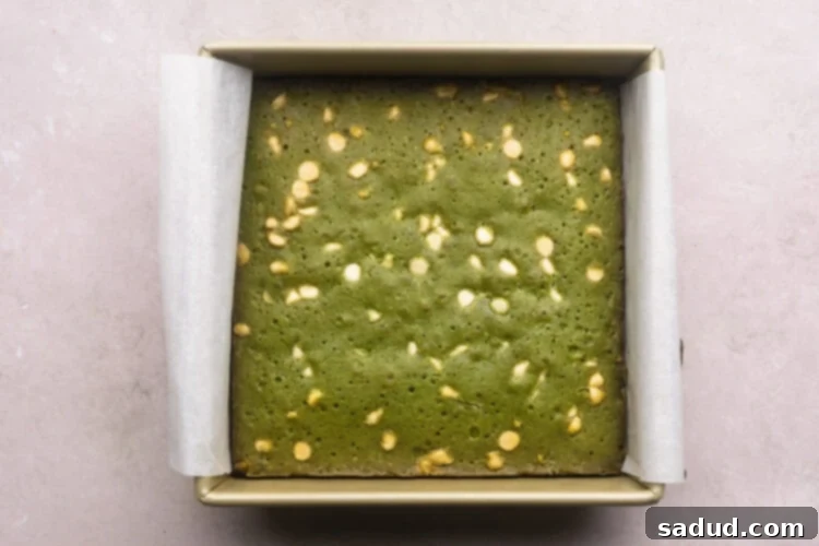 Matcha Magic White Chocolate Brownies 7 Fully baked matcha brownies in a square baking dish.