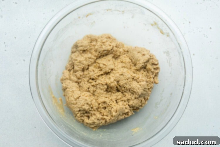 Seitan "dough" for vegan chicken sandwiches in a large glass mixing bowl.