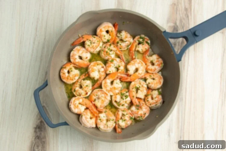 Shrimp scampi in skillet.