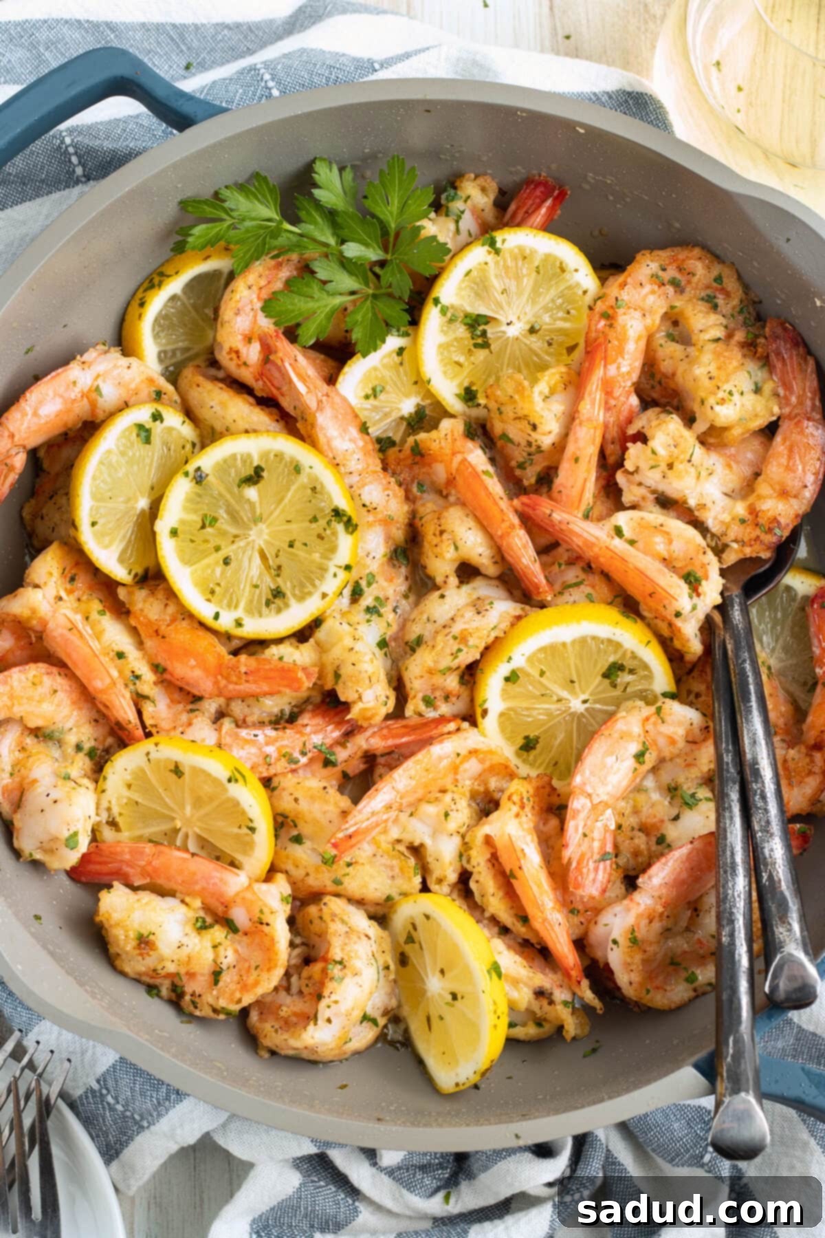Shrimp francese in a large skillet.