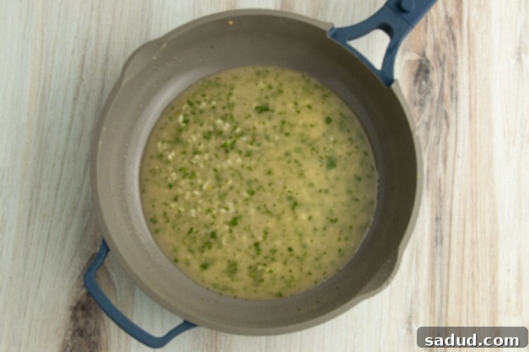 Butter and garlic in skillet.