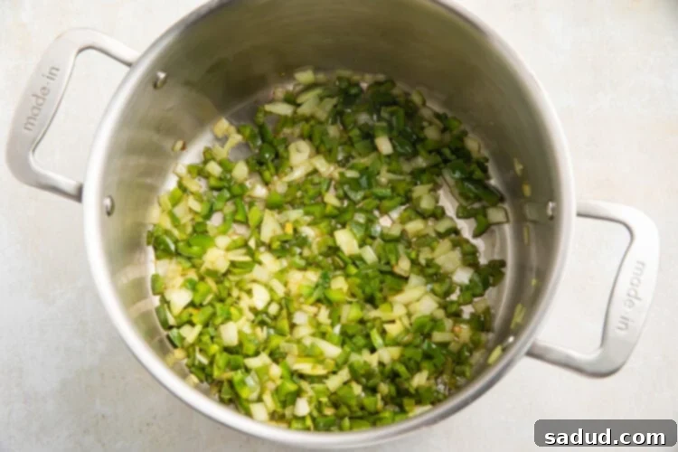 Jalapeño peppers and onions in a large saucepan.