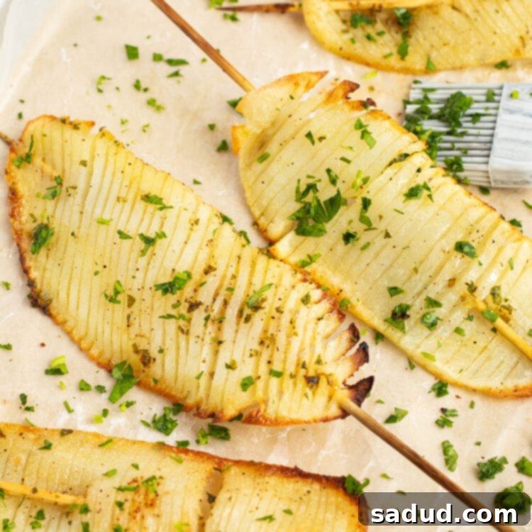 Crispy Accordion Potatoes with Garlic Herb Butter on a Skewer