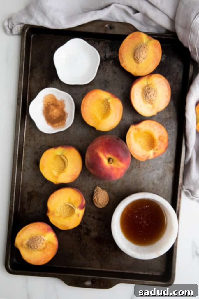 Halved peaches with pits removed, showing the juicy flesh before grilling