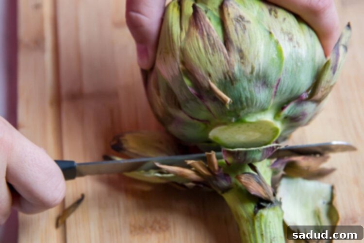 Cut away stems from artichoke.