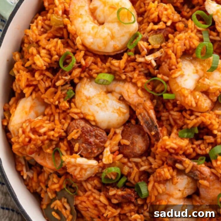 Spicy Cajun Seafood Medley 6 A large Dutch oven brimming with rich, flavorful seafood jambalaya, prepared with tender shrimp and perfectly cooked rice, ready to be served.