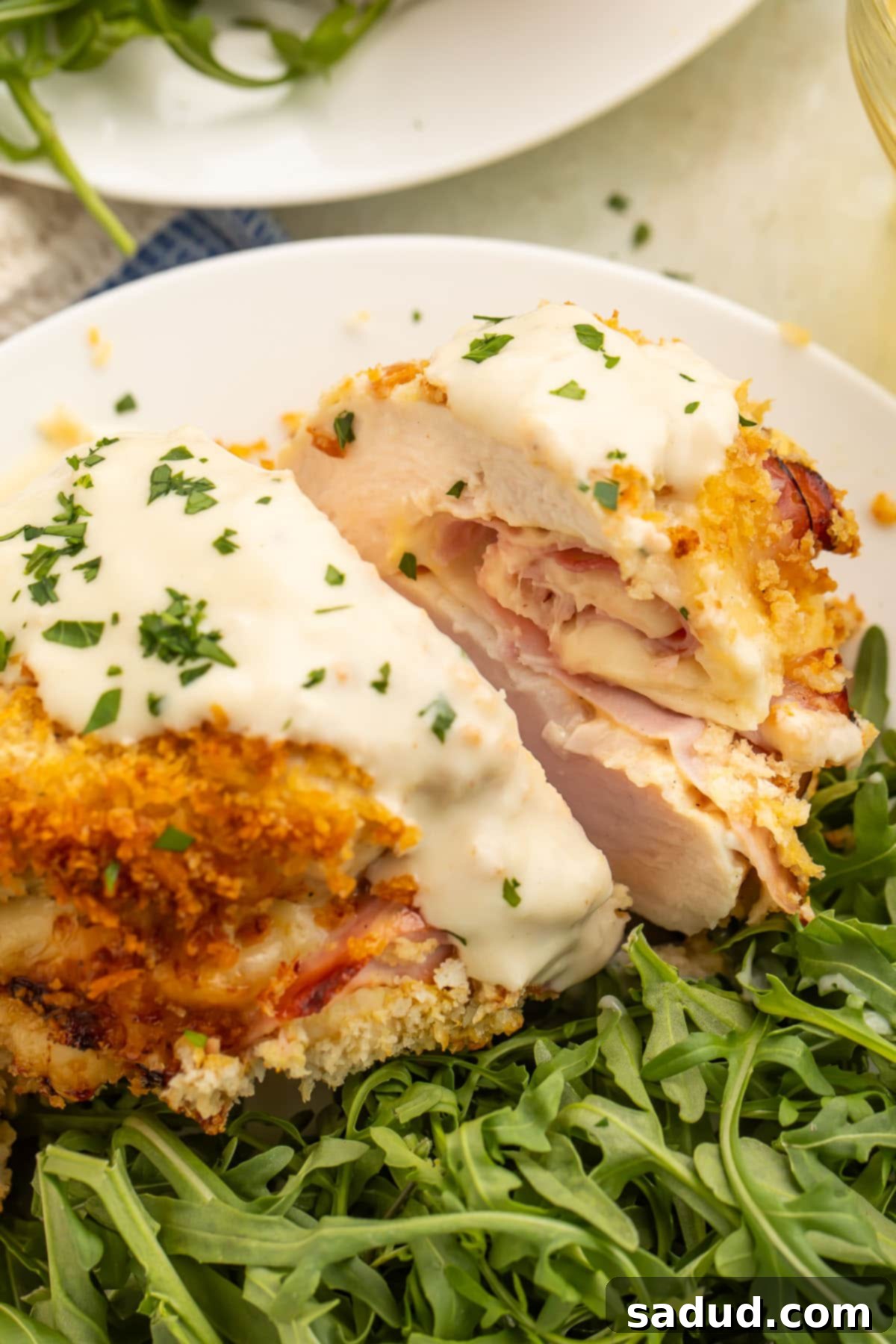 Crispy Air Fryer Chicken Cordon Bleu 4 Air fryer chicken cordon bleu plated with a green salad.