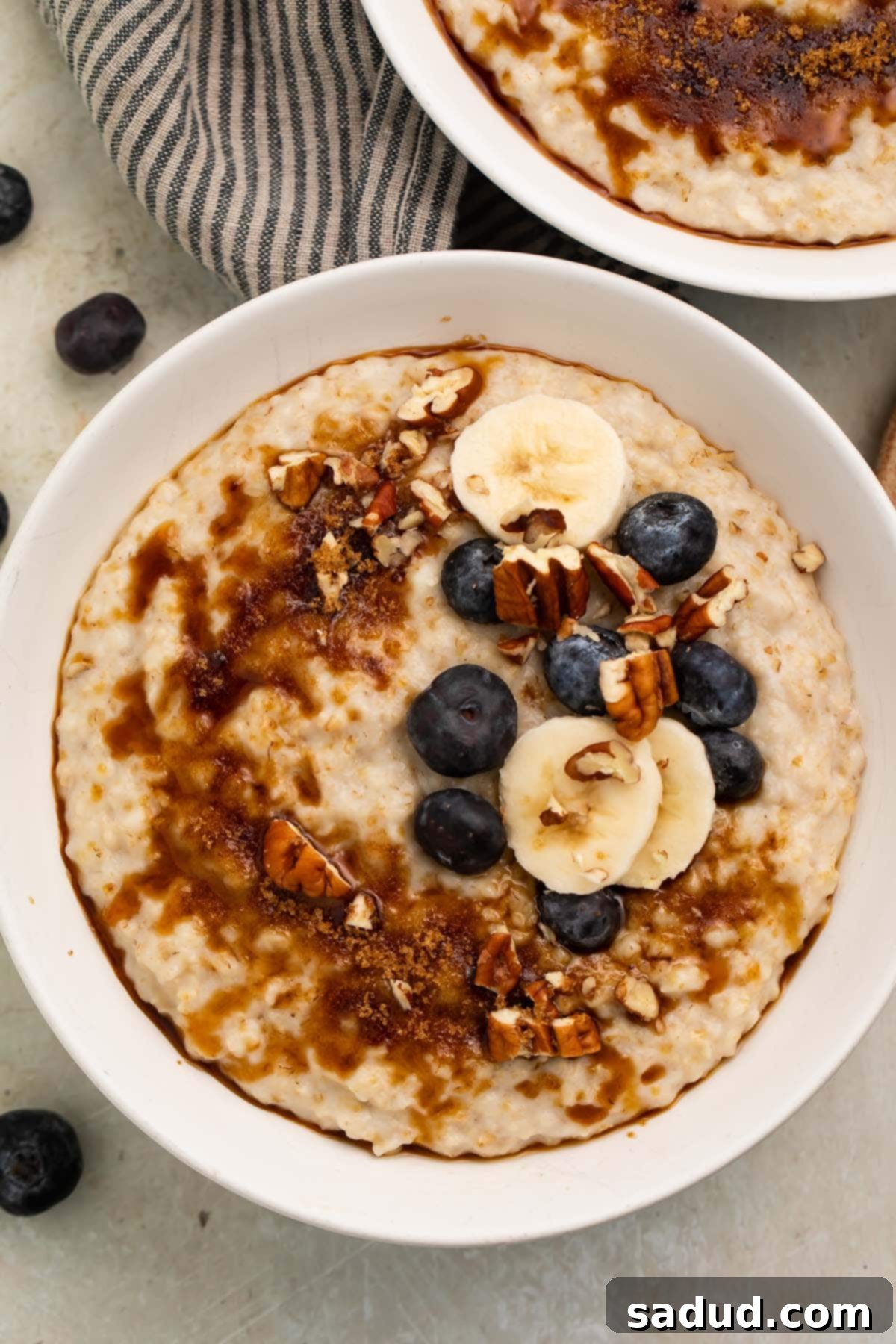 Creamy Instant Pot Oatmeal 3 A second perspective of the creamy Instant Pot Oatmeal, highlighting its rich texture and colorful toppings like fresh berries and banana slices, signifying a wholesome and enjoyable breakfast.