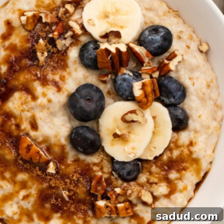 Creamy Instant Pot Oatmeal 4 A large bowl of creamy Instant Pot Oatmeal topped with chopped pecans, sliced bananas, and fresh blueberries.