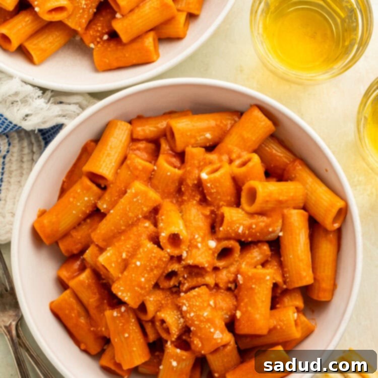 Two white bowls of rigatoni alla vodka.
