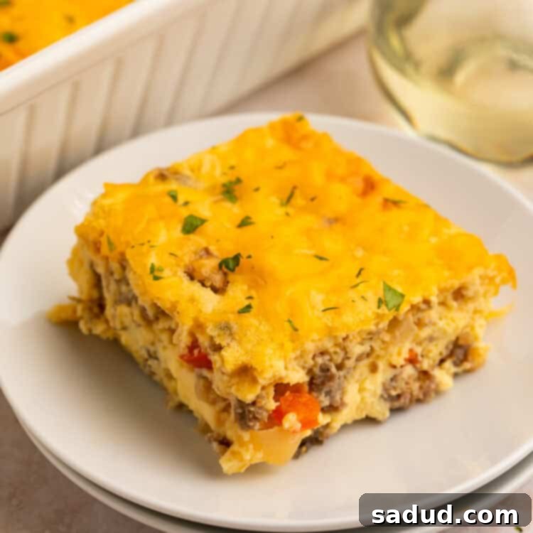 A beautiful, golden-brown High Protein Egg Bake with Cottage Cheese, shown on a white plate, with the full casserole dish in the background.