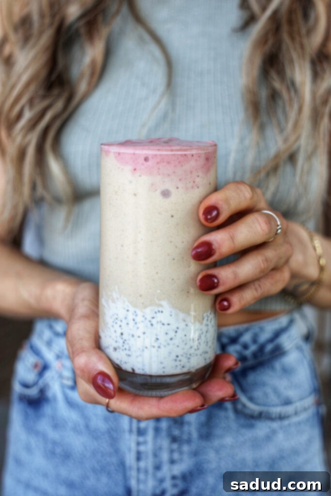 Delicious strawberry banana chia smoothie in a glass with a spoon