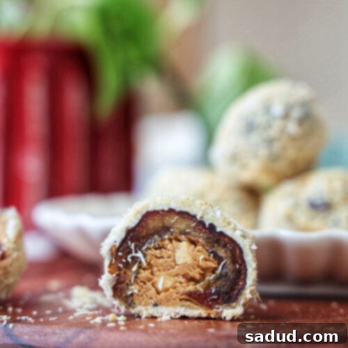 A top-down view of several Rafaello Dates on a plate, showcasing their white chocolate and coconut coating.