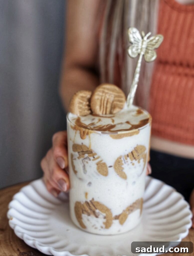 A close-up of a jar filled with creamy Nutter Butter Nice Cream, showcasing its smooth texture and delicious appearance.