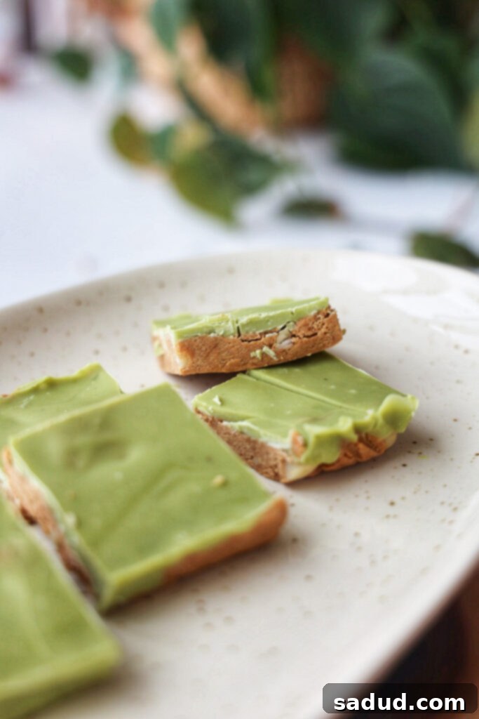 A plate of white choc macadamia cookie dough bars, showcasing their delicious layers and inviting texture.