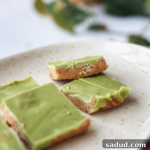 A second image of the white choc macadamia cookie dough bars, highlighting the perfect bite.