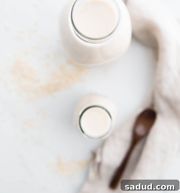 Homemade oat milk in a glass bottle, perfectly creamy and ready to drink
