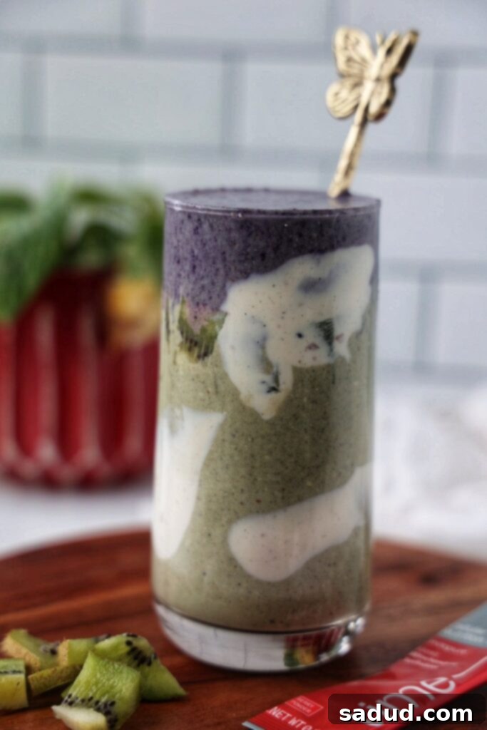 Healthy Aging Smoothie 3 A close-up of a healthy aging smoothie, garnished with fresh berries and mint.