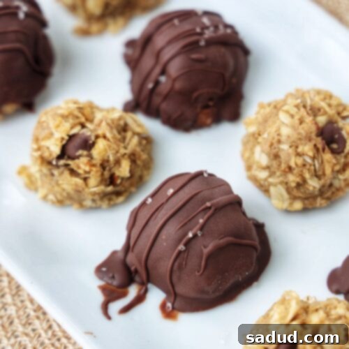 Perfectly round peanut butter oatmeal cookie balls, dipped in chocolate and ready to enjoy as a healthy snack or dessert.
