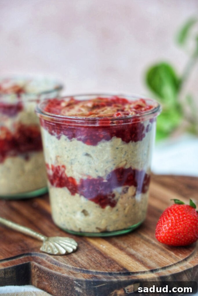 Delicious layered Peanut Butter and Jelly Overnight Oats in a jar, ready for a healthy breakfast.