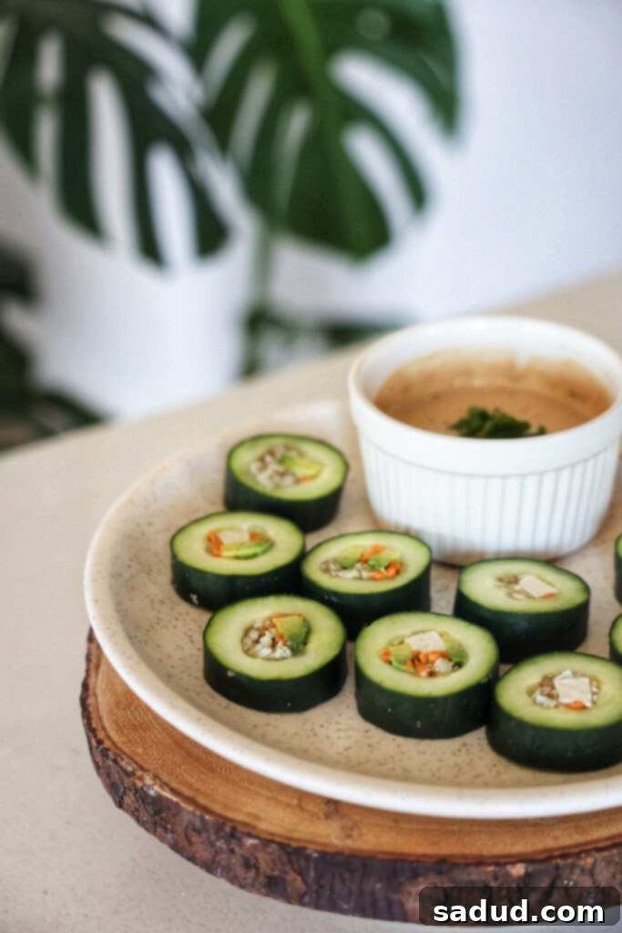 A plate of healthy cucumber sushi rolls with tofu and avocado. 