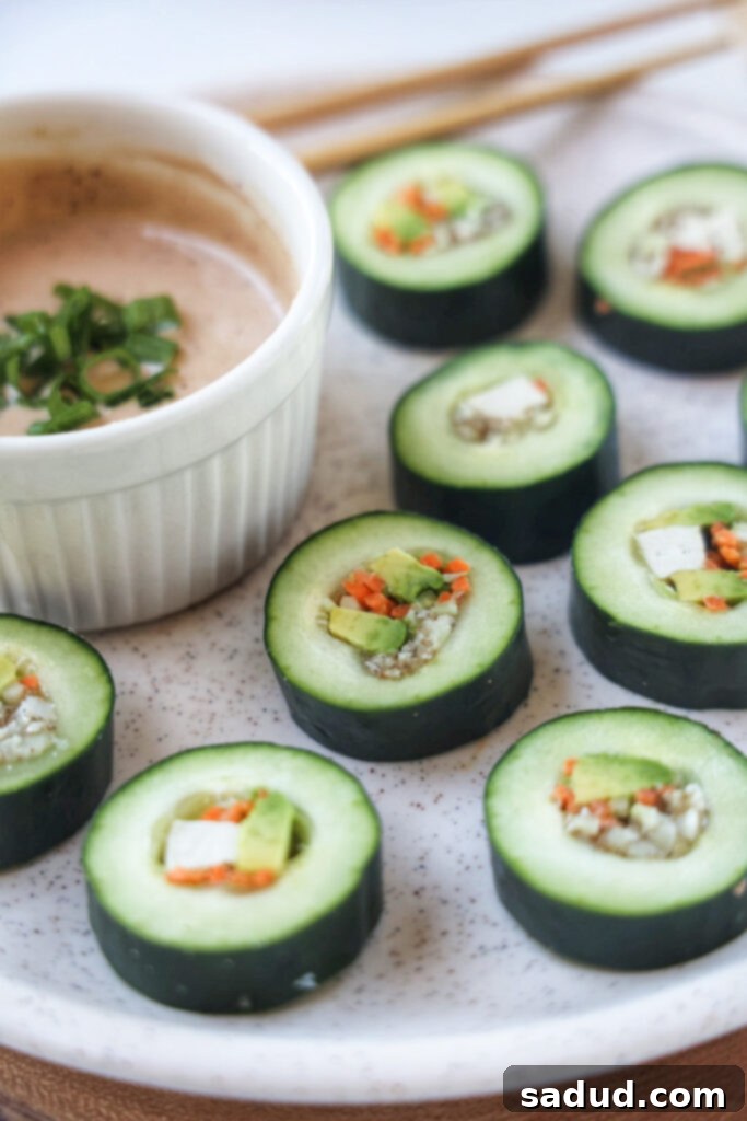 A plate of healthy cucumber sushi rolls with tofu and avocado. 