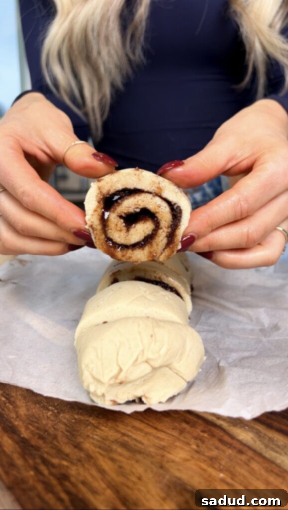 Baking sweet potato cinnamon rolls in a muffin tin.